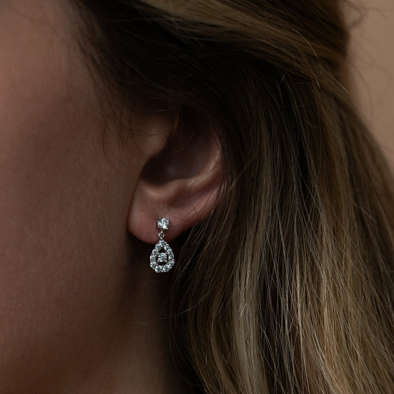 9 carat white gold pear shape stone set drop earrings
