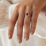 9 carat yellow gold halo dress ring with created ruby